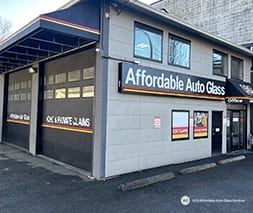 Front of the Affordable Auto Glass building with ICBC and private claims signage